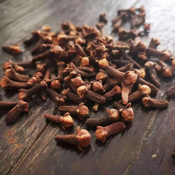 Handful of dried cloves isolated on white background